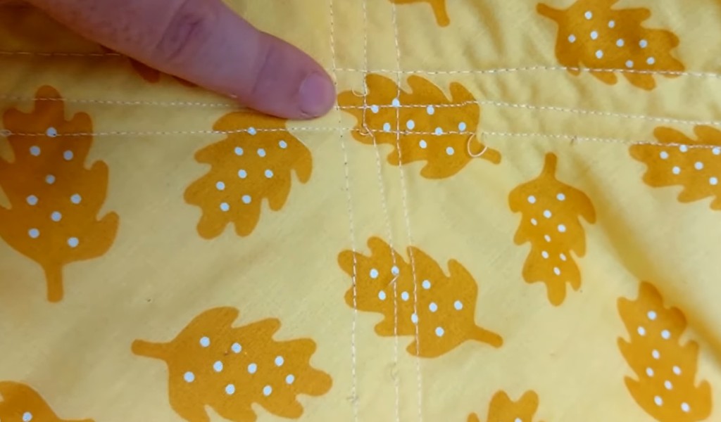 What Should Be Adjusted if the Machine Stitches Are Uneven or Looping on Either Side of a Fabric?